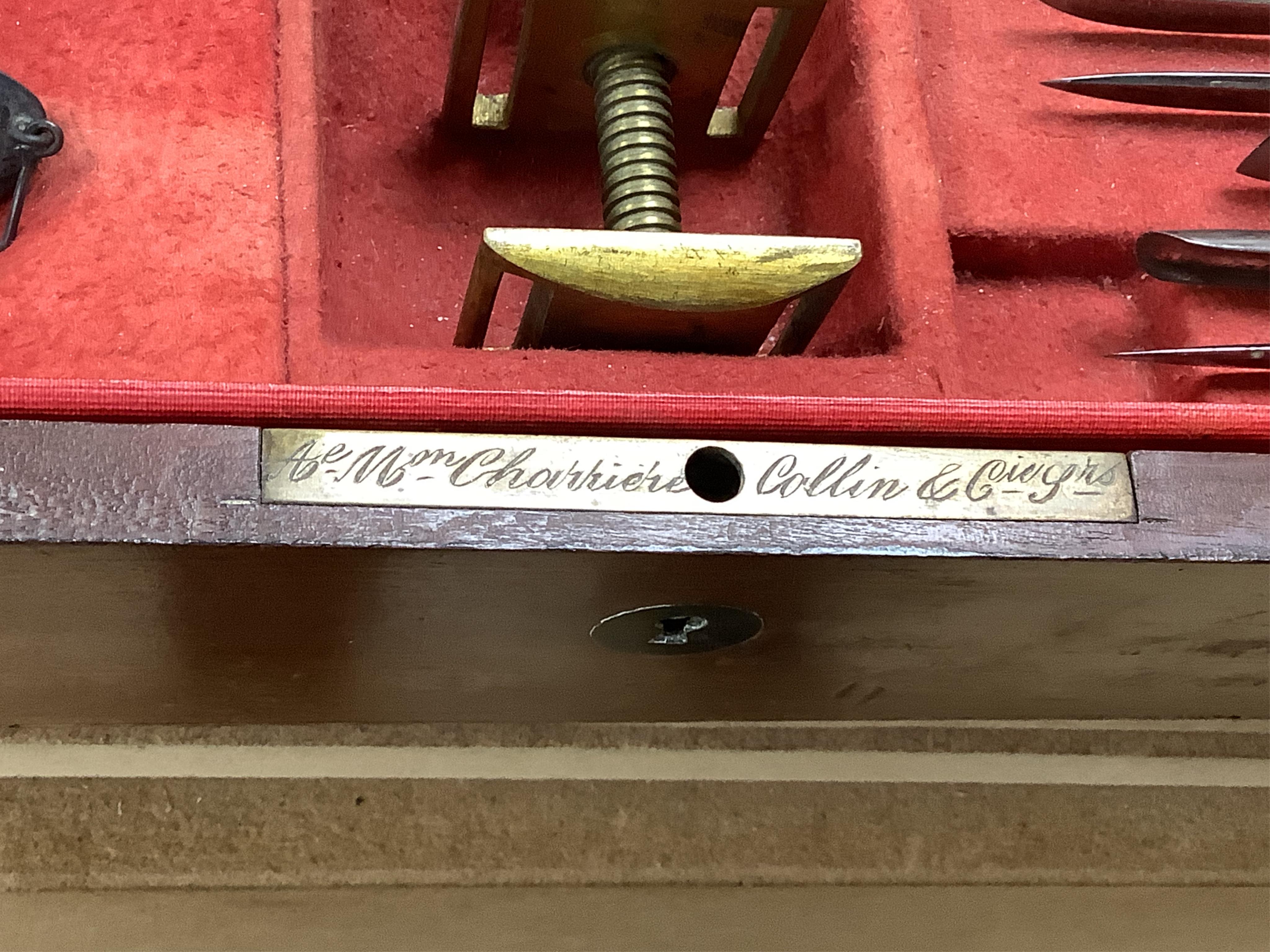 A 19th century surgeon’s set signed Mon. Charriere, Collin & Cie., Paris, in a fitted mahogany case, comprising of steel surgeons instruments; knives, scalpels, scoops, tourniquet, saws, rasps, some instruments stamped w